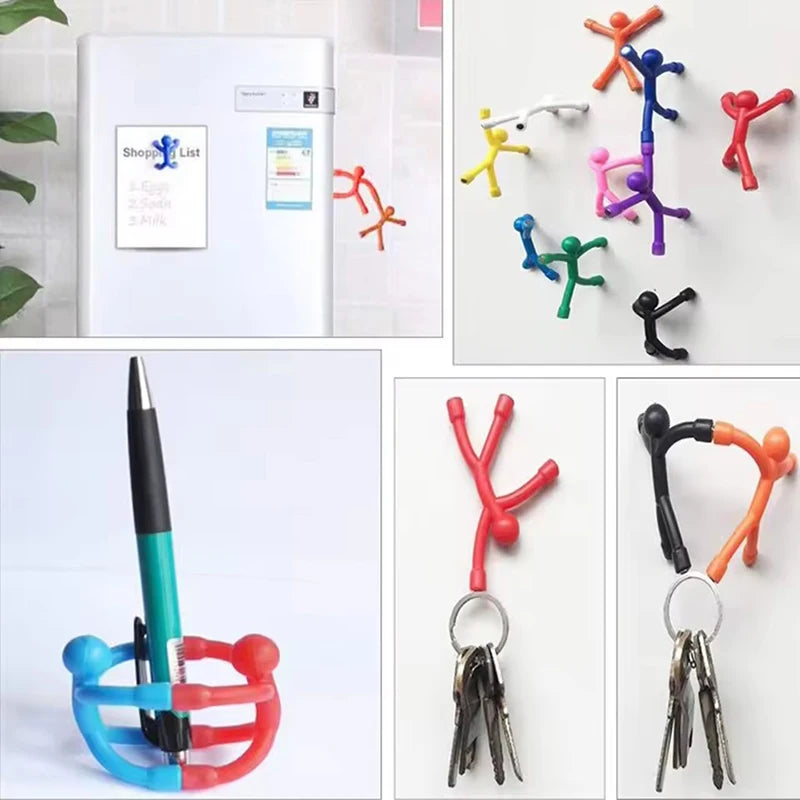 Magnetic stick figures stuck to a fridge door in different poses