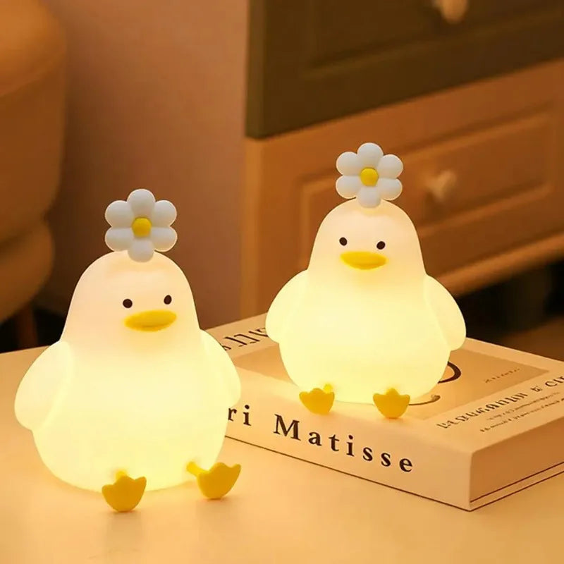 Duck LED night light glowing in a dark bedroom
