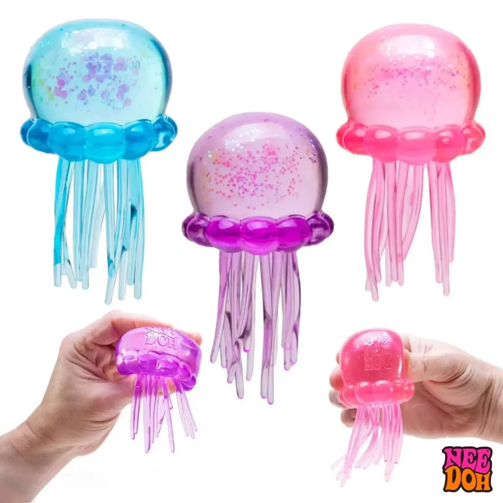 Jellyfish squish ball flattened under a squeezing hand