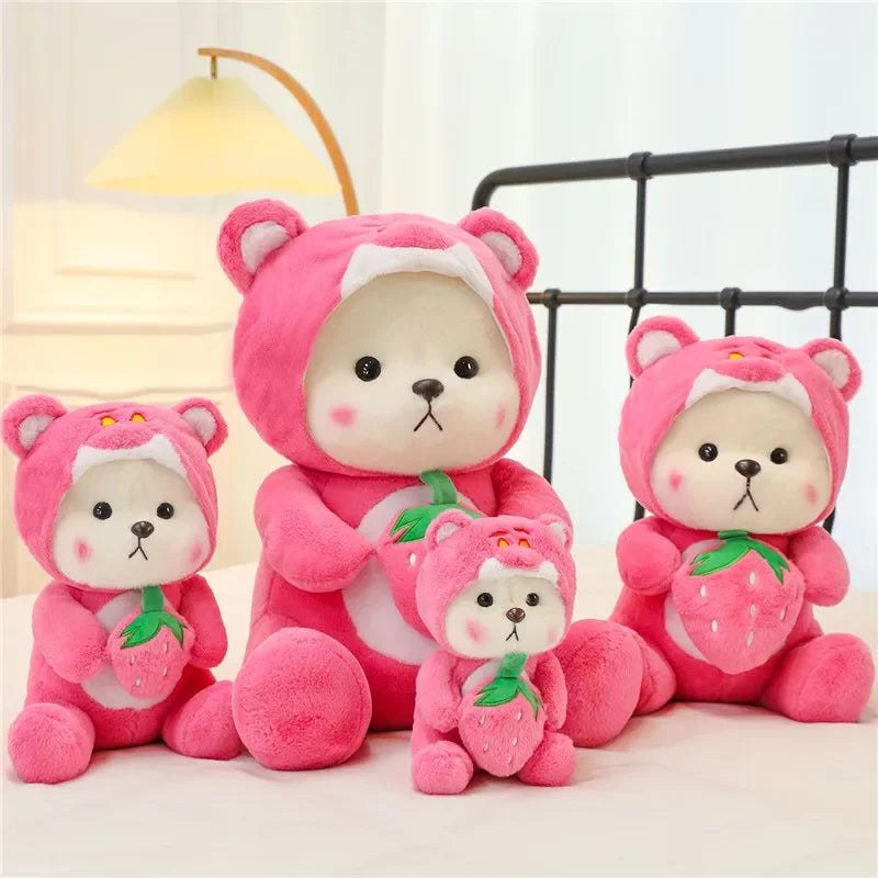 Pink bear plush holding a strawberry