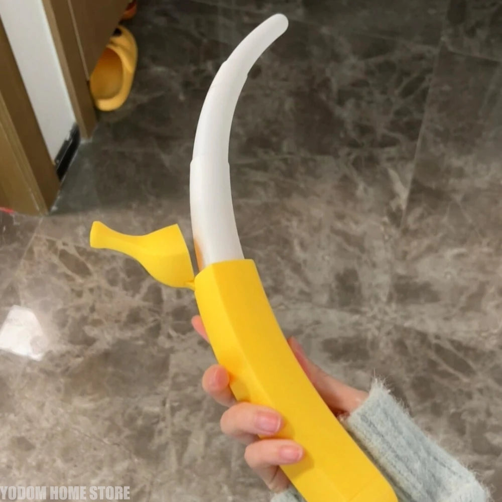 Hand holding retractable banana sword in compact banana mode