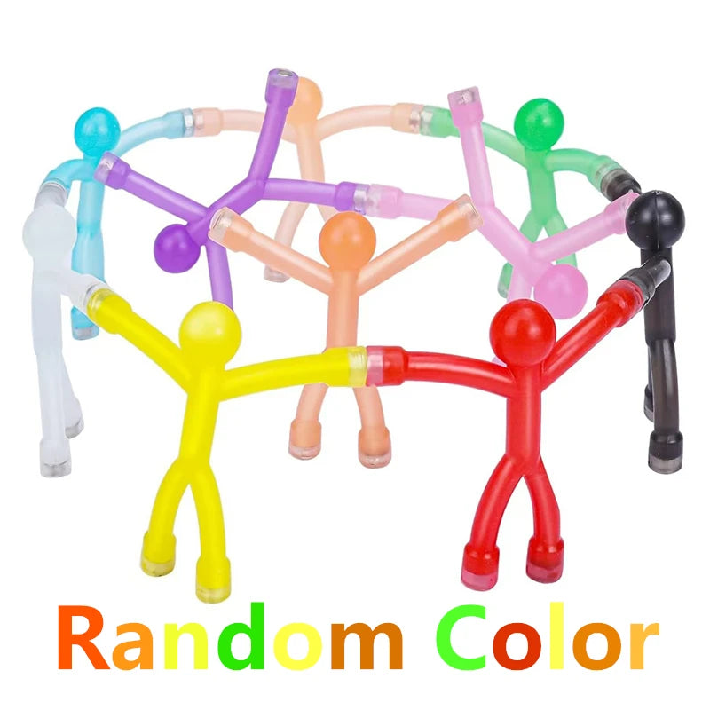Magnetic stick figures gripping a metal surface