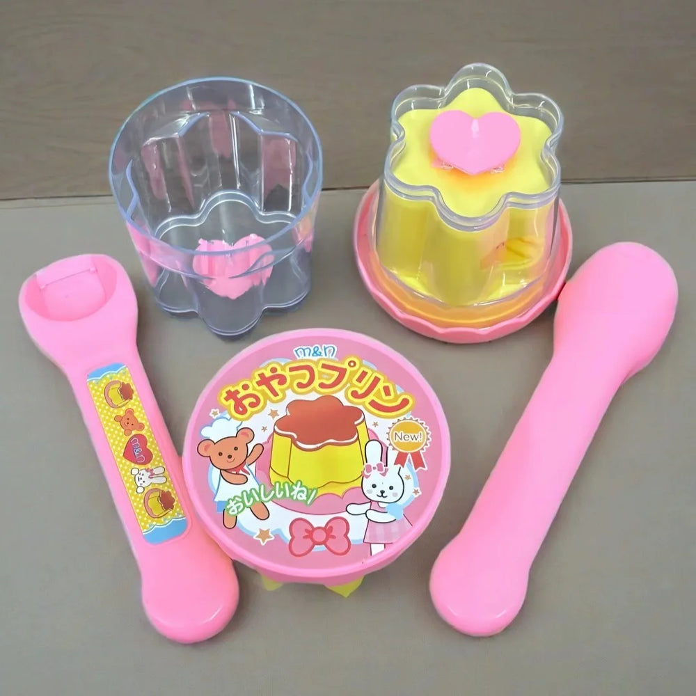 Close-up of the toy spoon and pretend pudding
