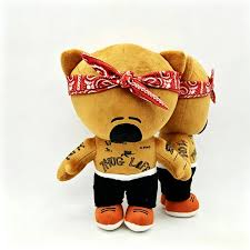 Close-up of the plush buddy's stitched face and bandana knot