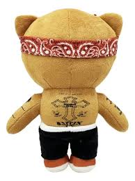 Red bandana plush buddy held in a hand for size reference